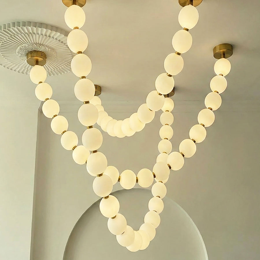 Pearl strand draped into a soft curve
