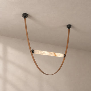 Altalena Leather Alabaster Pendant Light Vidirlighting 1-Light Deep U-Loop Swing Pendant with Black Leather Strap and Brushed Brass Canopies Studio Shot