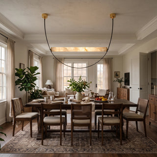 Altalena Leather Alabaster Pendant Light Vidirlighting Wide-Span Horizontal Alabaster Light Beam Suspended on Draped Black Leather Straps over Long Dining Table