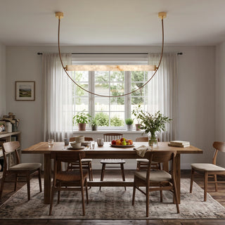 Altalena Leather Alabaster Pendant Light Vidirlighting Cognac Leather Straps with Brushed Brass Canopies Supporting Alabaster Cylinder in Bright Dining Nook