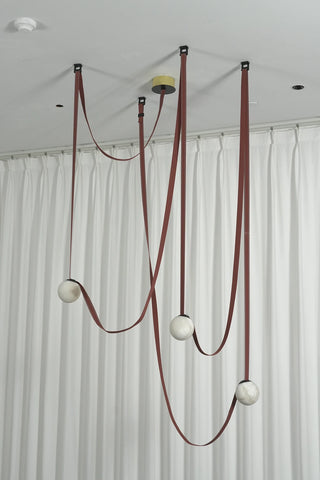 Anouk Draped Strap Alabaster Chandelier Vidirlighting Asymmetrical Swag Belt Suspension with Natural Stone Globe Pendants Hanging from Ceiling Anchors