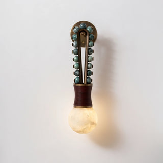 Ardora Beaded Alabaster Wall Sconce Vidirlighting Illuminated with Warm Glowing Alabaster Orb and Emerald Green Stone Beads on Textured Plaster Wall
