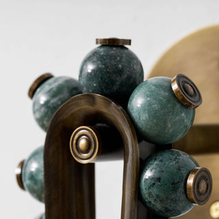 Ardora Beaded Alabaster Wall Sconce Vidirlighting Macro Close-Up of Arched Hairpin Crown with Polished Green Gemstone Beads and Stepped Brass Cap Nuts