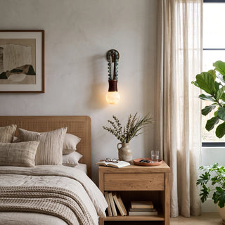 Ardora Beaded Alabaster Wall Sconce Vidirlighting with Green Beads and Glowing Stone Orb beside Rattan Headboard and Oak Nightstand in Cozy Bedroom