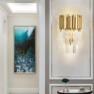 Bourbons Crystal Sconce lighting an elegant entryway, gold crystal wall sconce mounted above decorative console table with abstract teal painting on adjacent wall