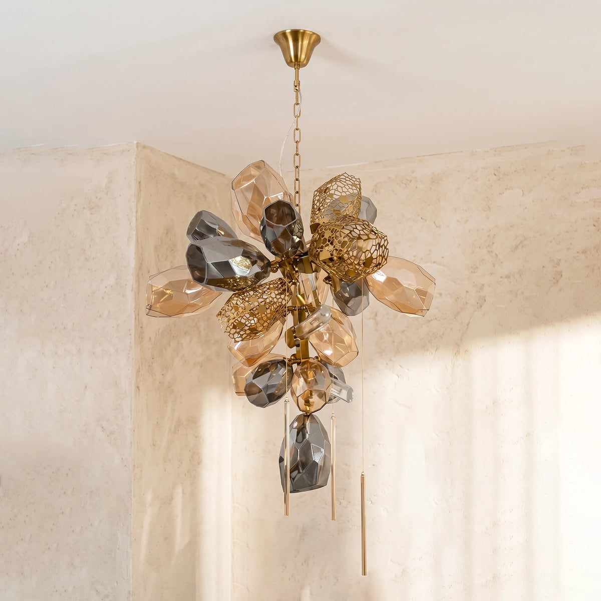 Amber and smoky gray faceted glass globes with gold mesh spheres