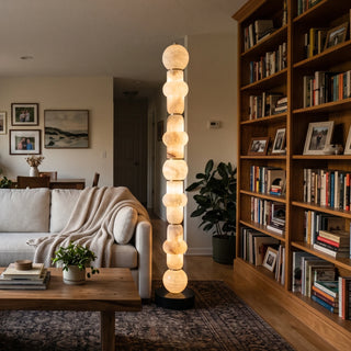 Cairn Alabaster Stacked Floor Lamp Vidirlighting Illuminated Natural Alabaster Floor Lamp between Vintage Black Leather Couch and Window Wall