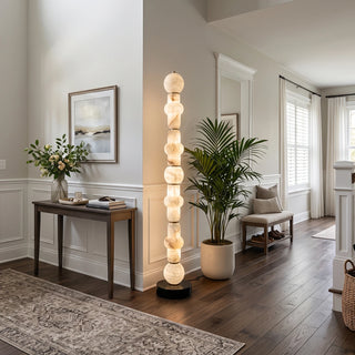 Cairn Alabaster Stacked Floor Lamp Vidirlighting Highlighting Walnut Media Cabinet and Fireplace in Moody Contemporary Living Room