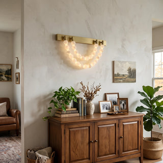 Collana Alabaster Bead Wall Sconce Vidirlighting Statement U-Shaped Alabaster Stone Bead Swag Wall Fixture on Textured Plaster Wall over Wooden Credenza