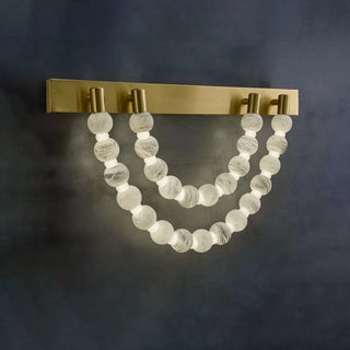 Collana Alabaster Bead Wall Sconce Vidirlighting Unlit Frontal View Highlighting Natural White Alabaster Beads Strung in Double Swags on Brass Bar