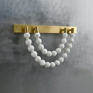 Collana Alabaster Bead Wall Sconce Vidirlighting Fully Lit Double-Tier Alabaster Bead Swag Sconce Casting Warm Amber Light Rays on Wall