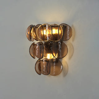 Conca Glass Disc Wall Sconce Vidirlighting Angled Perspective Lit Test Showing Dimensional Amber Light Refraction and Wall-Washing Effect