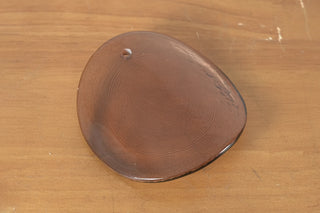 Conca Glass Disc Wall Sconce Vidirlighting Individual Curved Amber Textured Glass Petal Showing Precision Mounting Hole on Wood Table