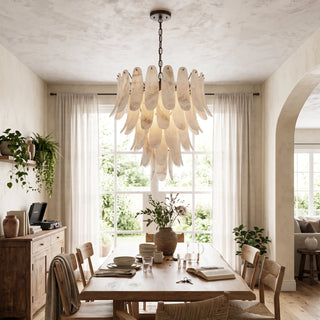 Cygnus Alabaster Feather Chandelier Vidirlighting Warm Ambient Light Diffusing over Farmhouse Dining Table and Wood Credenza below Beamed Ceiling