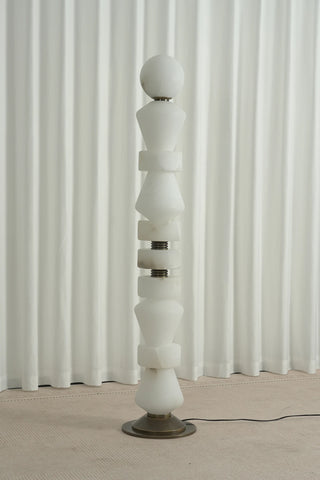 Geometric Alabaster Sculptural Floor Lamp Vidirlighting Unlit Full Standing View of Natural White Translucent Stone Totem Column with Antique Bronze Base against Fluted Drapes