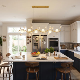 Ginkgo Vine 6-light linear chandelier above an open kitchen island with marble countertop by Vidir Lighting