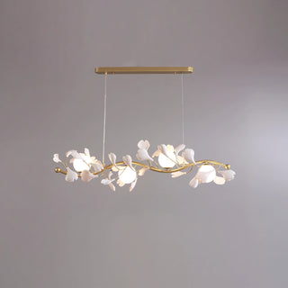 Ginkgo Vine linear branch chandelier illuminated against a neutral grey studio background by Vidir Lighting