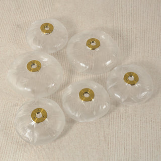 Glass Petals Floor Lamp Vidirlighting Group of Handmade Clear Textured Glass Petal Shades with Center Brass Washers Laid on Fabric Flatlay