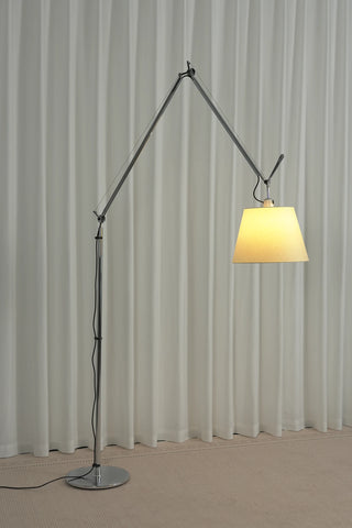 Gru Adjustable Arm Floor Lamp Vidirlighting Illuminated Side View Highlighting Deep Cantilever Projection and Warm Glowing Lampshade
