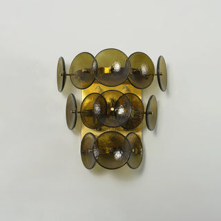 Lente Hammered Glass Disc Wall Sconce Vidirlighting Frontal Lit Studio Display Highlighting Light Refraction through Dimpled Glass Disc Facets