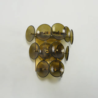 Lente Hammered Glass Disc Wall Sconce Vidirlighting Unlit Perspective Angle Highlighting Translucent Hammered Amber Discs and Precision Brass Peg Fasteners