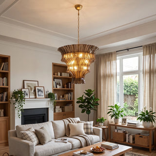 Lido amber smoke tiered textured glass chandelier in a cozy living room with fireplace by Vidir Lighting