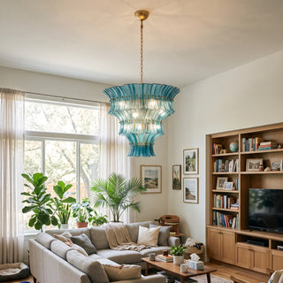 Lido ocean blue tiered textured glass chandelier hanging in a modern living room by Vidir Lighting
