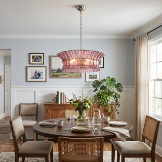 Lido rose pink single-tier textured glass chandelier in a transitional dining room by Vidir Lighting