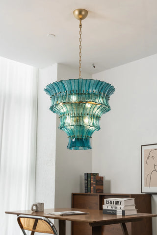 High-angle showroom view of Lido teal blue tiered glass chandelier by Vidir Lighting