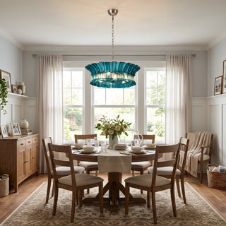 Lido teal blue single-tier textured glass chandelier over a wooden dining table by Vidir Lighting