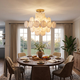 Lunaria Alabaster Disc Ceiling Light Vidirlighting Warm Brass Mount with Botanical Disc Petals over Round Wood Dining Table with Garden Window View