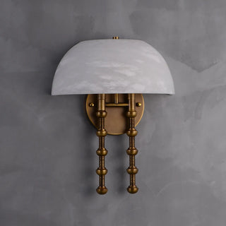 Ombrellino Alabaster Wall Sconce Vidirlighting Illuminated Studio Sample Showing Glowing White Stone Dome and Dual Ribbed Brass Stems on Plaster Wall