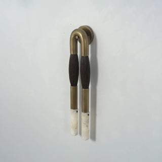 Pennello Horsehair Alabaster Wall Sconce Vidirlighting Angled Perspective of Black Armature with Blonde Horsehair Lit in Studio Corner