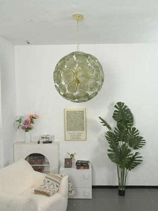 Soffione Glass Disc Sphere Chandelier Vidirlighting Green Glass Dandelion Sphere Light Lit above Lounge Chair and White Decorative Fireplace Mantel