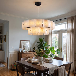 Tegola Two-Tier Alabaster Chandelier Vidirlighting Two-Tier Circular Alabaster Stone Chandelier Hung before Library Bookcase and Fireplace