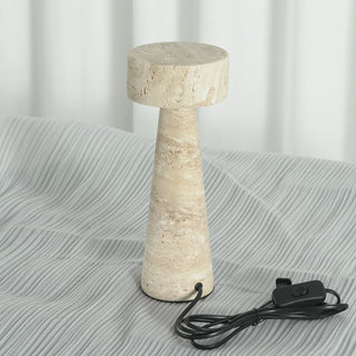 Travertine Kiwa Conical Table Lamp Vidirlighting Fully Illuminated in Dark Room Casting Warm Downward Ambient Glow Highlighting Porous Stone Texture