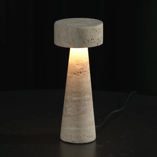 Travertine Kiwa Conical Table Lamp Vidirlighting Brutalist Sculptural Profile Unlit Featuring Natural Veined Beige Travertine Stone on Dark Background