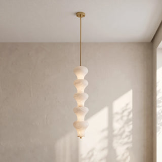 Trottola Alabaster Stacked Pendant Light Vidirlighting 3-Tier Brushed Brass Stacked Alabaster Pendant Light Illuminated in Architectural Studio Setting