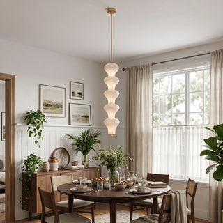 Trottola Alabaster Stacked Pendant Light Vidirlighting Single Brushed Brass Multi-Tier Alabaster Stone Pendant Centered over Round Dining Table in Breakfast Nook