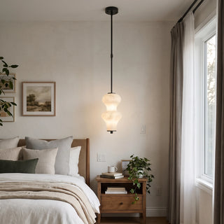 Trottola Alabaster Stacked Pendant Light Vidirlighting Set of Three Matte Black Alabaster Stacked Pendants Suspended over White Marble Kitchen Island