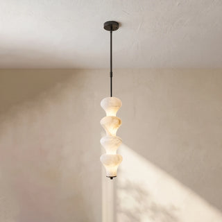 Trottola Alabaster Stacked Pendant Light Vidirlighting 3-Tier Matte Black Hardware Stacked Alabaster Pendant Illuminated in Modern Interior Corner