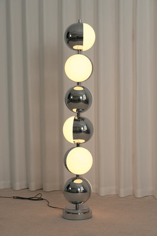 Vloer Floor Lamp Vidirlighting Daytime Unlit Placement in Living Room Lounge beside Coffee Accent Table Showcasing Sculptural Chrome Silhouette as Decor Art